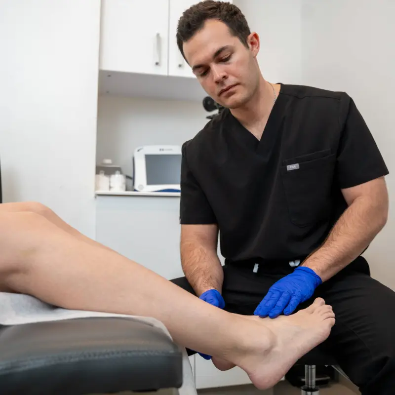 Dr. Shaun Cole performing a leg ultrasound evaluation on a patient at Vein Centers NY in Astoria, New York.